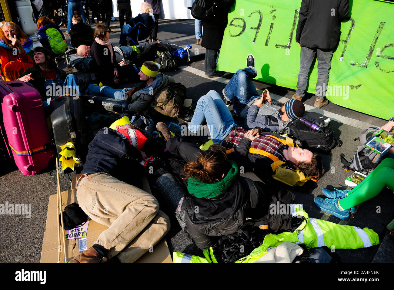 London, UK. Protesters lie in the middle of the road at Oxford Circus as part of the Extinction Rebellion. Stock Photo