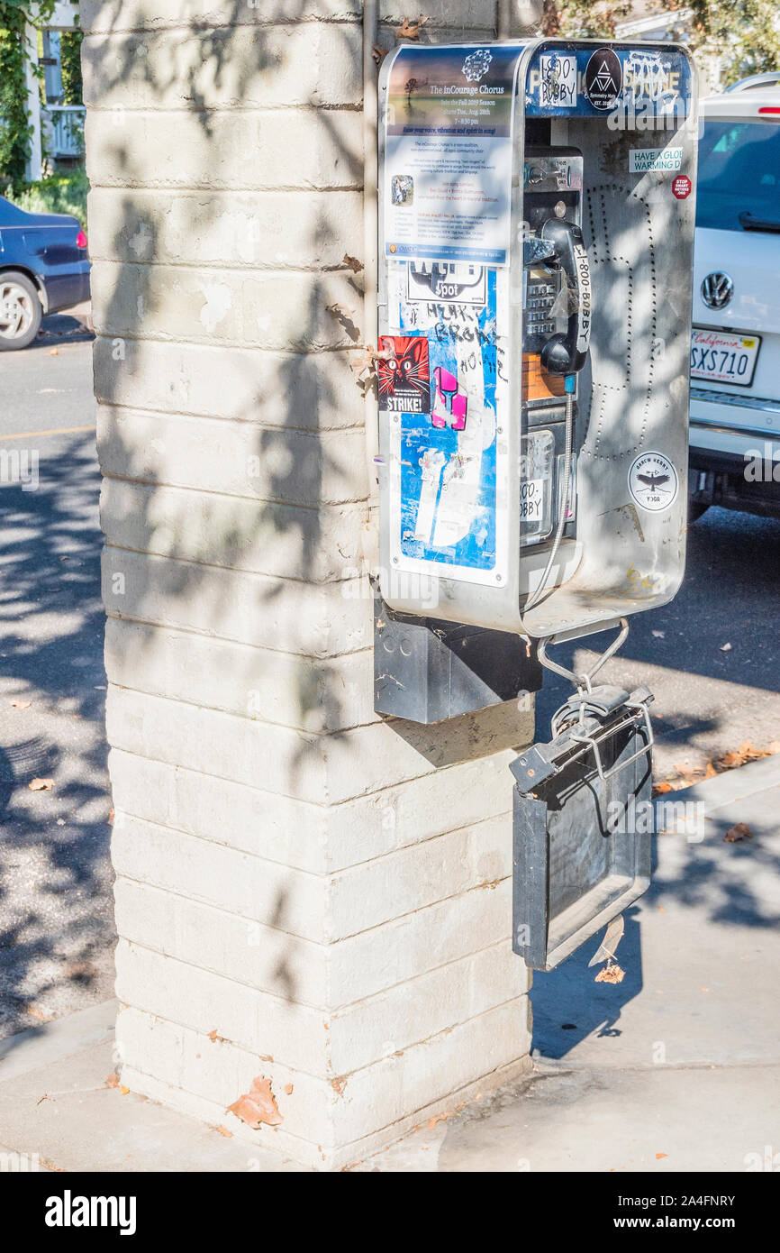 A pay telephone tagged with graffiti in Ojai, California Stock Photo