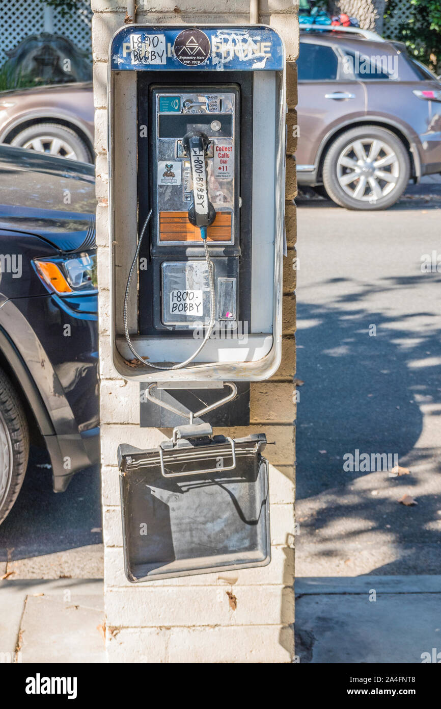 A pay telephone tagged with graffiti in Ojai, California Stock Photo