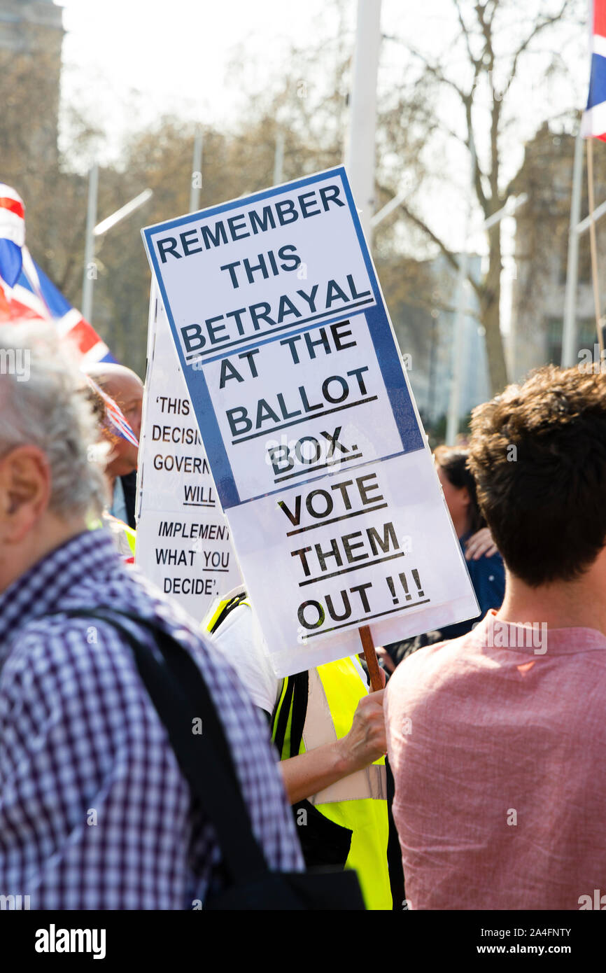 London, UK. Protester holding a sign at a pro-Brexit rally in Parliament Square. Stock Photo