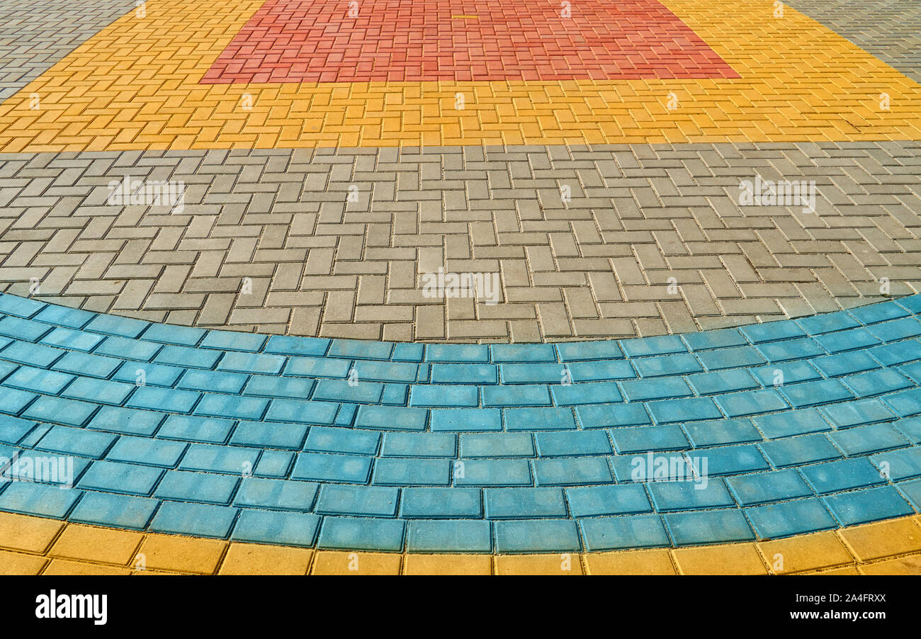 yellow, red and blue paving tiles for background or texture Stock Photo ...