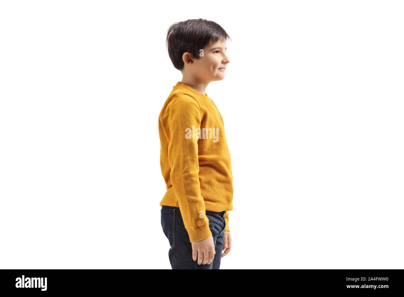 Profile shot of a boy in a yellow jumper isolated on white background Stock Photo