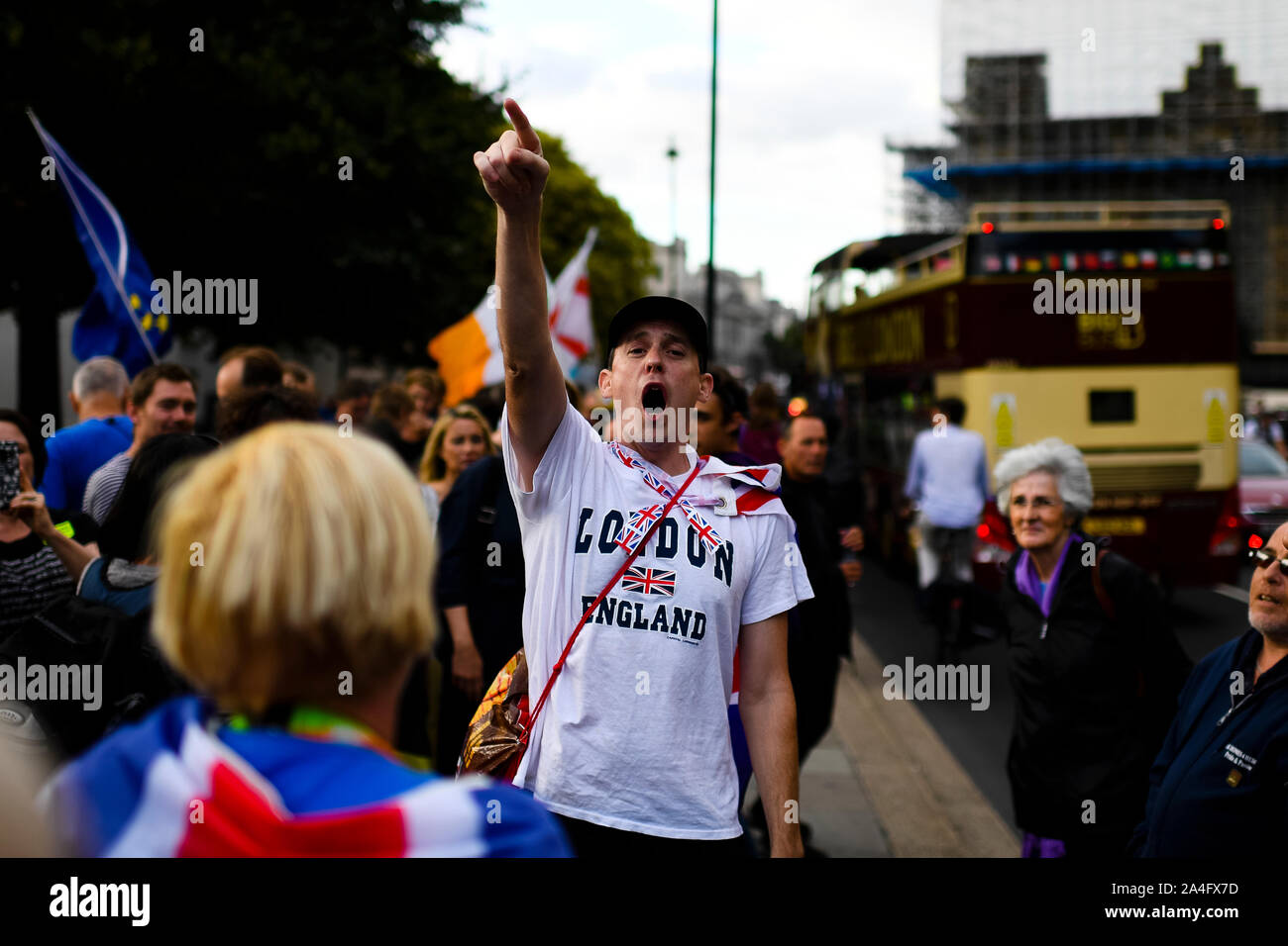London, UK. A pro-leave protester wearing a Union flag points in the air as he loudly vocalises his support for leaving the EU. Stock Photo