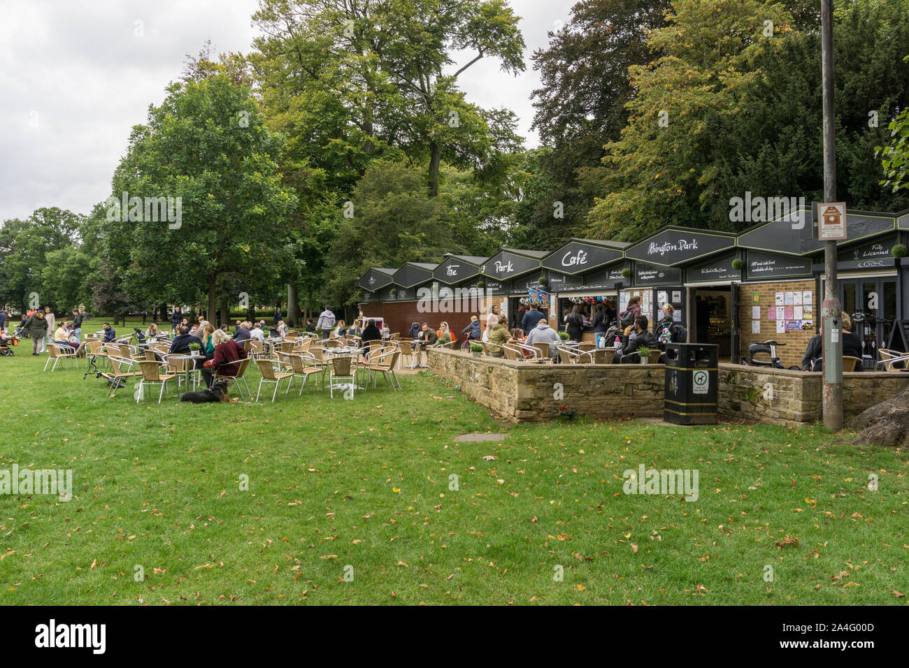 People enjoying some Al Fresco eating and drinking at the Park Cafe, Abington Park, Northampton, UK Stock Photo