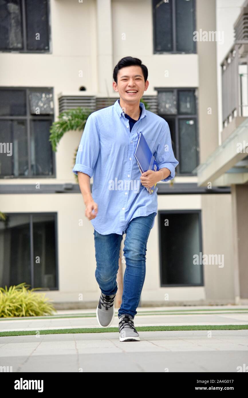 University Asian Male Student Having Fun Walking On Campus Stock Photo ...