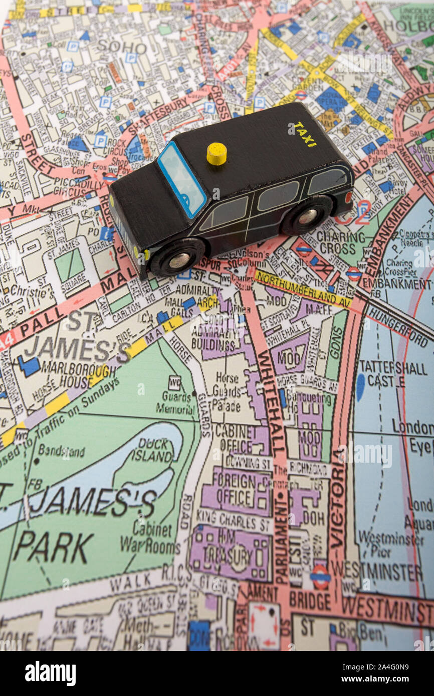 Toy Taxi cab on map of London, England Stock Photo