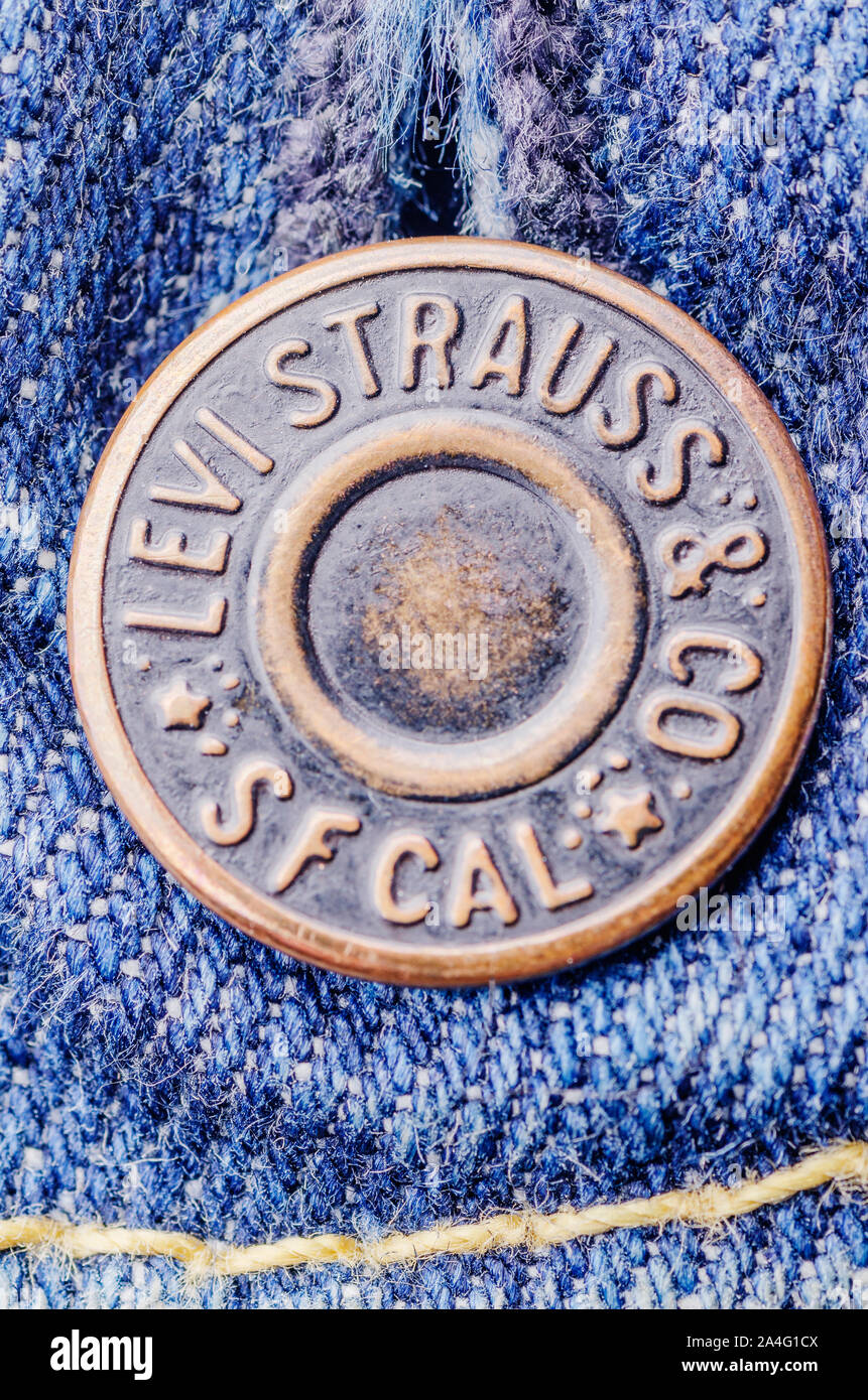 Closeup of Levi Strauss button on blue jeans Stock Photo - Alamy