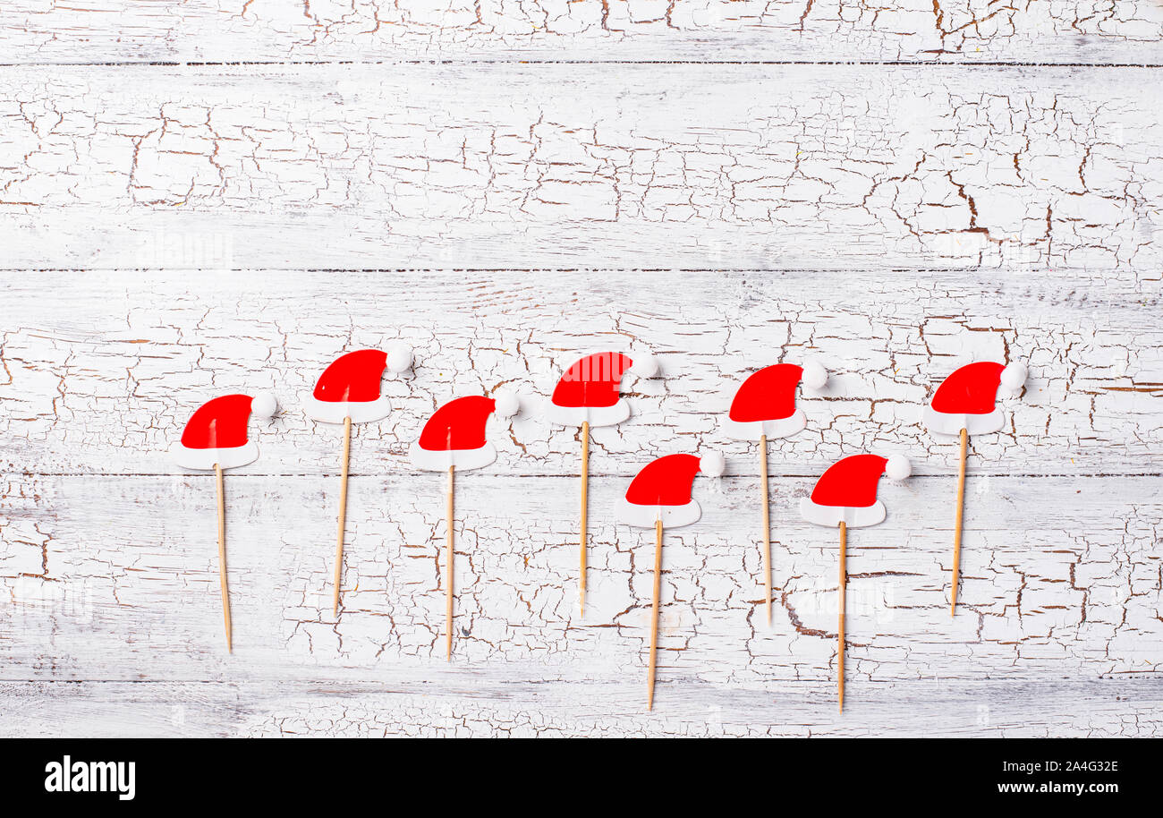 Christmas background with decorative Santa hats Stock Photo - Alamy