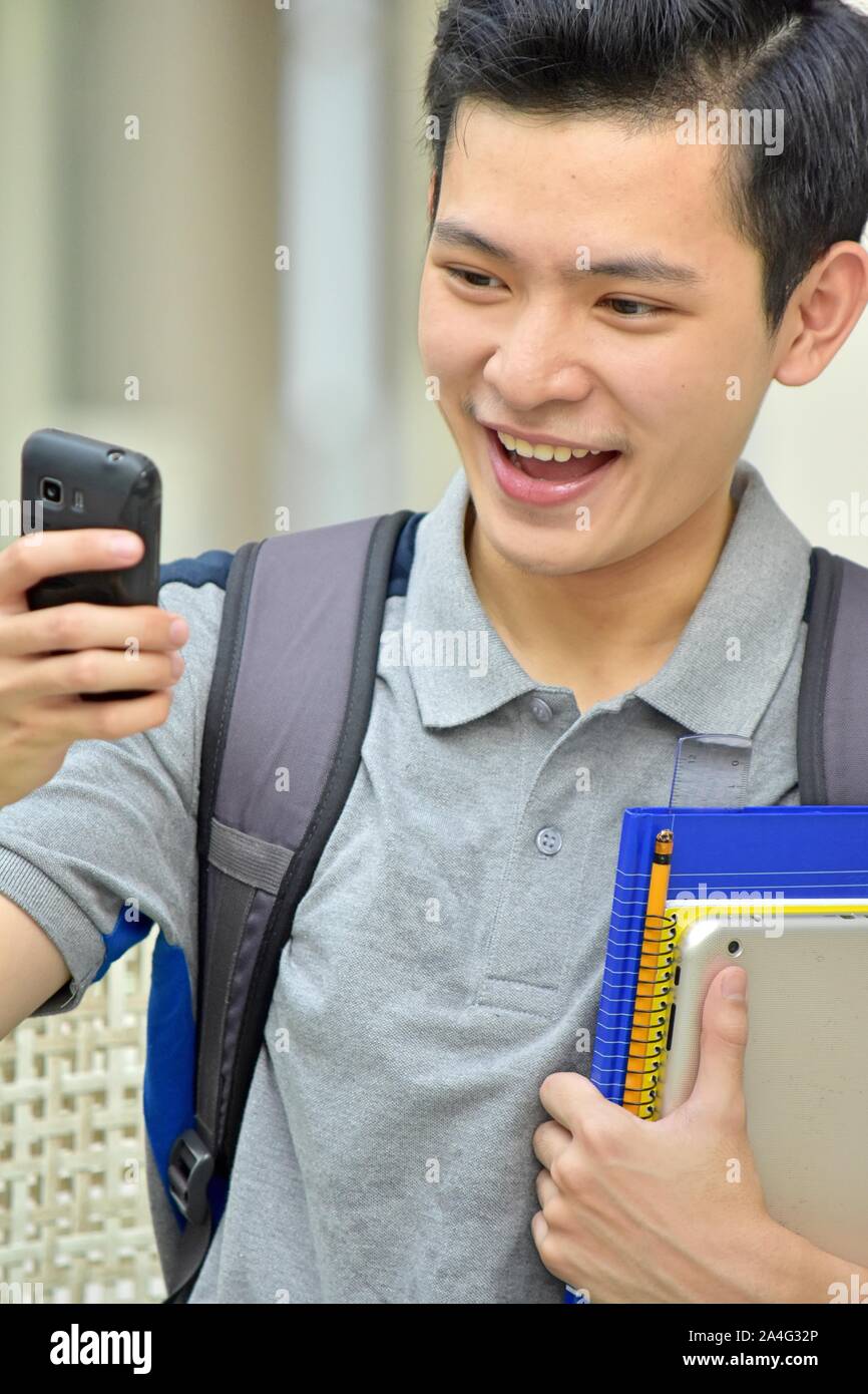 Male Student Selfy With Notebooks Stock Photo
