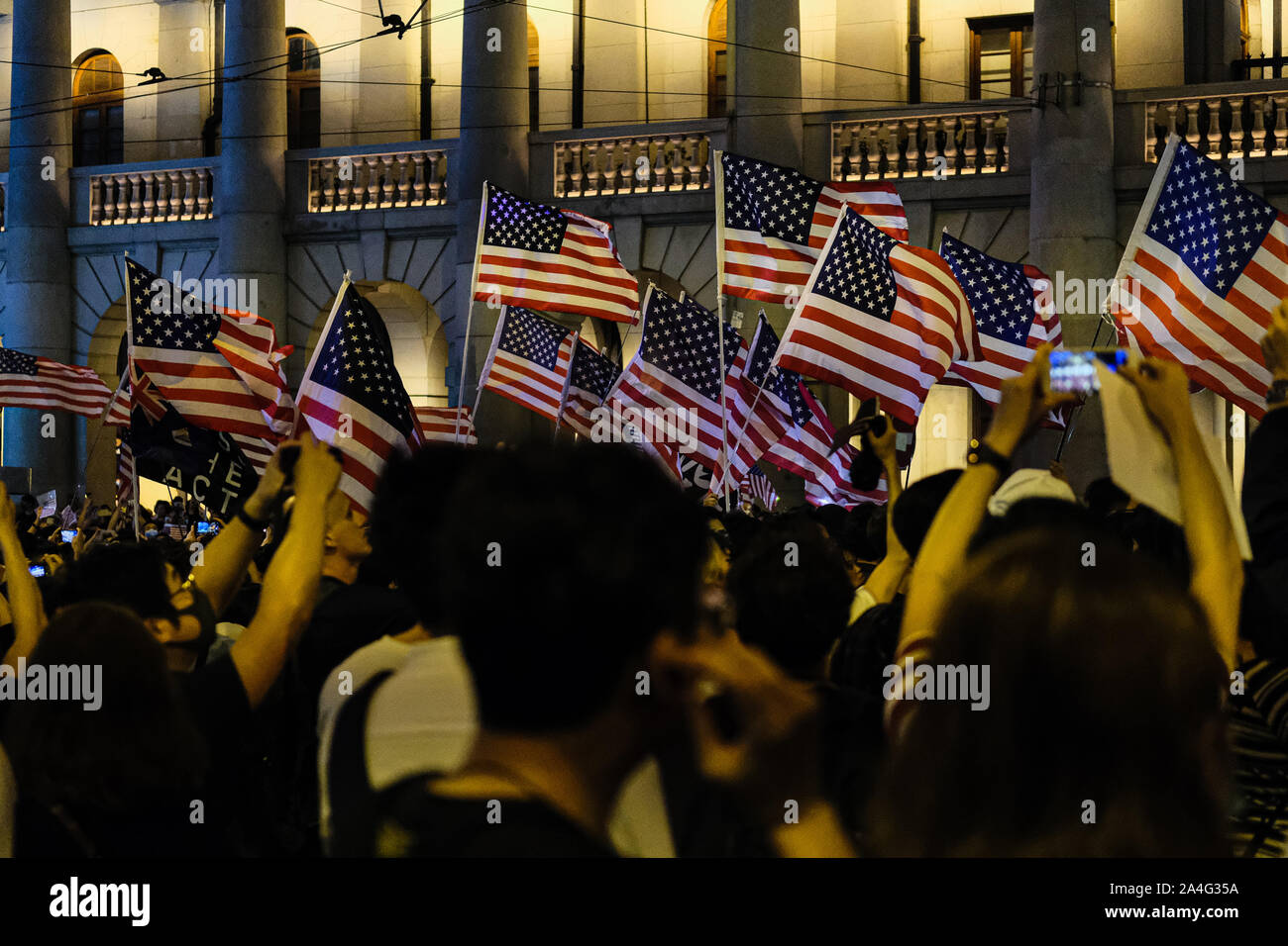 Hong Kong. 14th Oct, 2019. Protesters march with the flag of the United States attend Hong Kong Human Rights and Democracy Act Rally at Chater Garden in Central District Hong Kong. This rally was proposed to US lawmakers that they should pass the act that would help the Hong Kong democracy. Its aimed at putting pressure on Beijing to uphold its promise to preserve Hong Kongs autonomy. Credit: Keith Tsuji/ZUMA Wire/Alamy Live News Stock Photo
