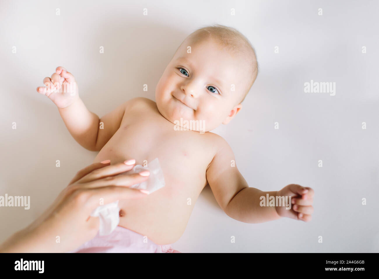 Mother Wiping Baby's body Stock Photo Alamy