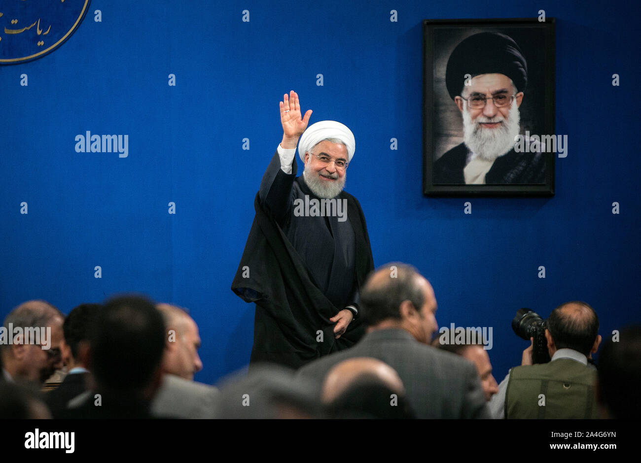 Tehran, Iran. 14th Oct, 2019. Iranian President Hassan Rouhani waves after a press conference in Tehran, Iran, on Oct. 14, 2019. Iranian President Hassan Rouhani said on Monday that his country does not endorse Turkey's approach to the current issues in northern Syria. Credit: Ahmad Halabisaz/Xinhua/Alamy Live News Stock Photo