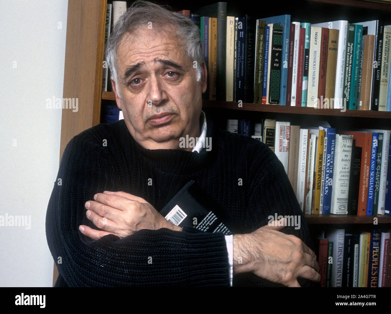 Professor Harold Bloom in his New York apartment. He answered questions from an interviewer resting on a day bed. Professor Harold Bloom answers questions during an interview in his New York apartment, May 12,1990. Harold Bloom, a prodigious literary critic who championed and defended the Western canon, published abundantly influential books that appeared not only on college syllabuses but also — unusual for an academic — on best-seller lists. Professor Bloom died on Monday October 14, 2019, at a hospital in New Haven. He was 89. Stock Photo