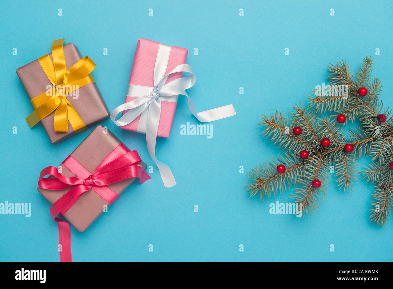 Christmas gift boxes with decoration on blue background. Stock Photo