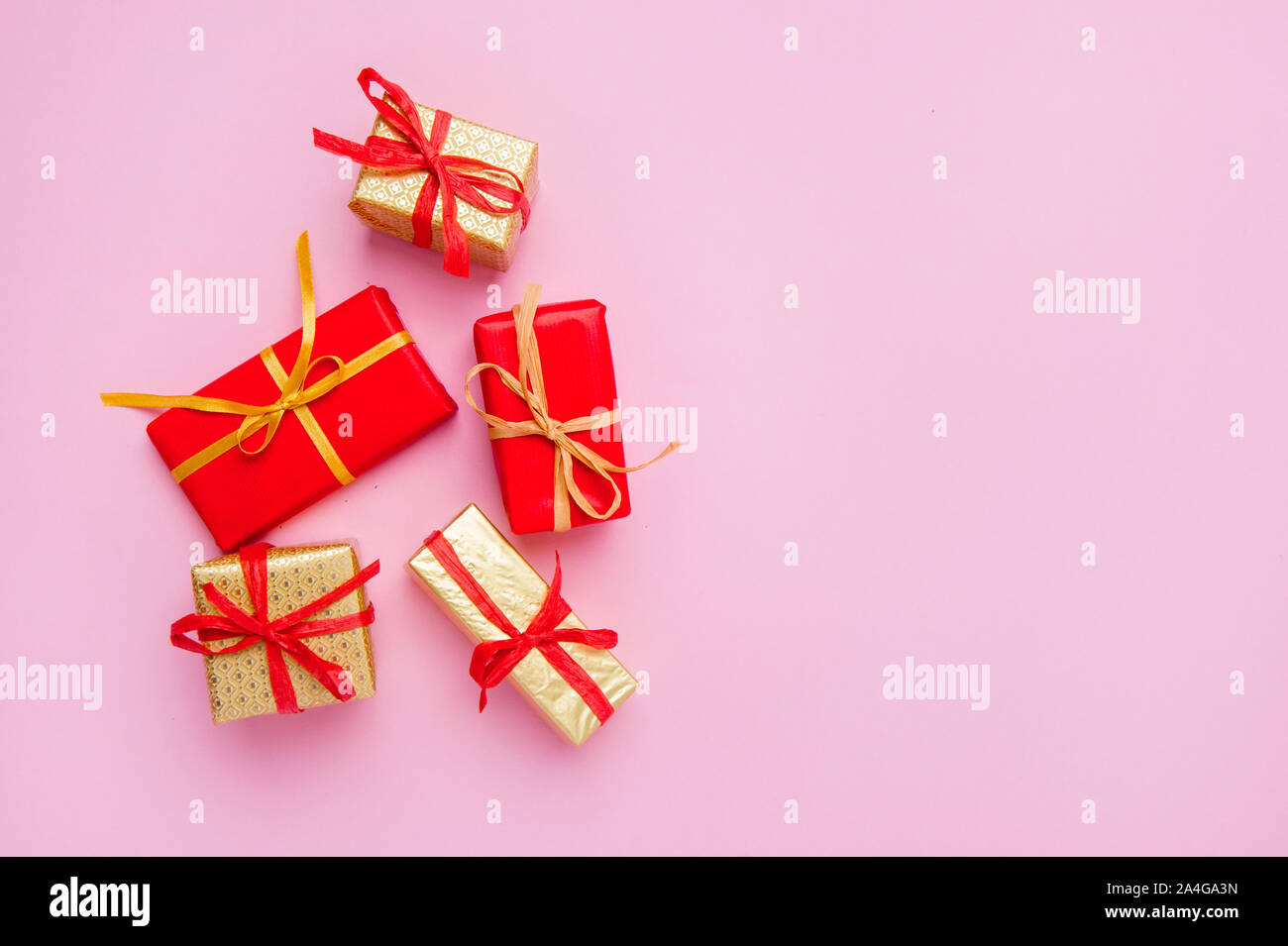 Christmas Gift Boxes Placed On Pink Background Stock Photo
