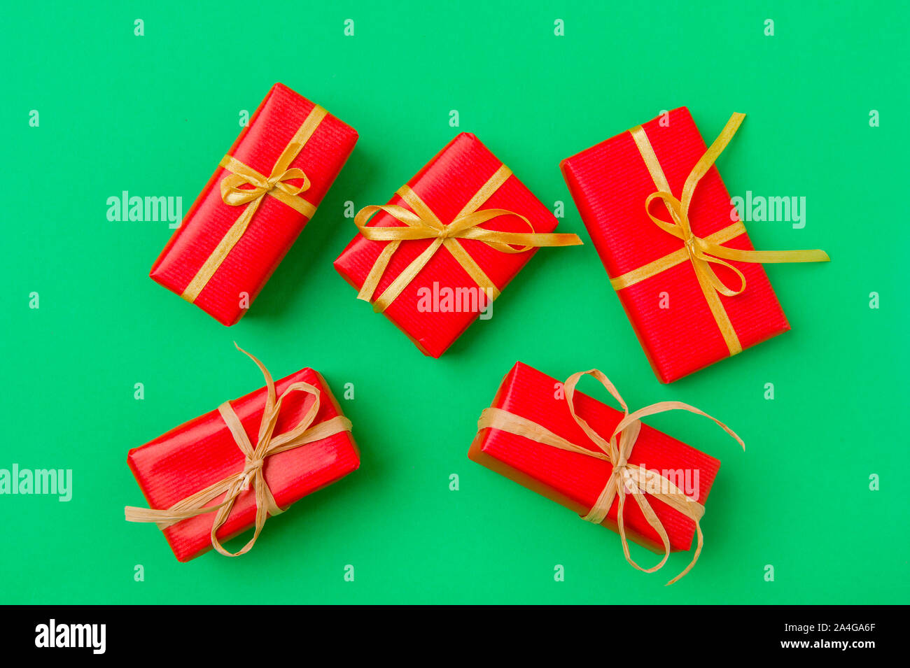 Christmas Gift Boxes Placed On Green Background Stock Photo