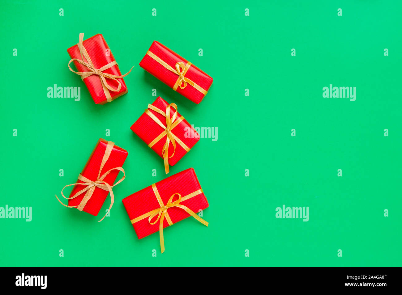Christmas Gift Boxes Placed On Green Background Stock Photo