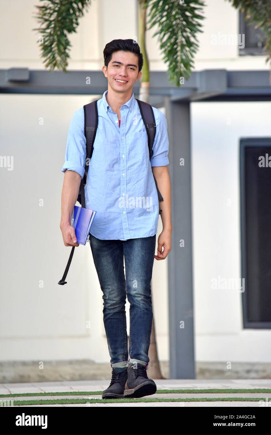College Asian Male Student Smiling Walking Stock Photo - Alamy