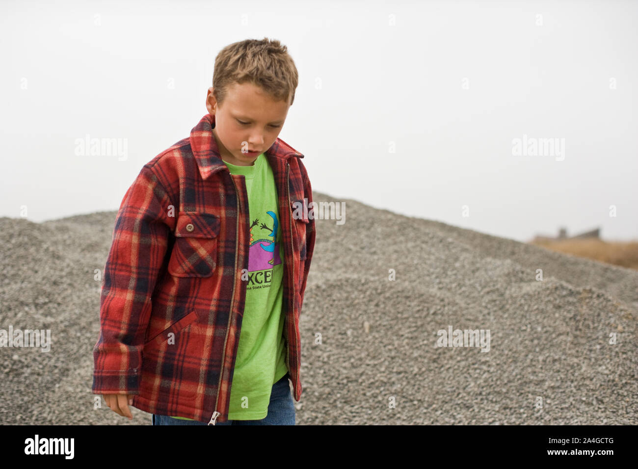 Boy playing with rocks hi-res stock photography and images - Alamy