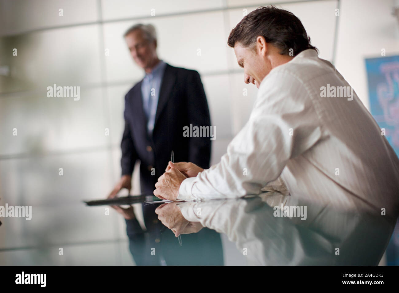 Man seated table in hi-res stock photography and images - Alamy