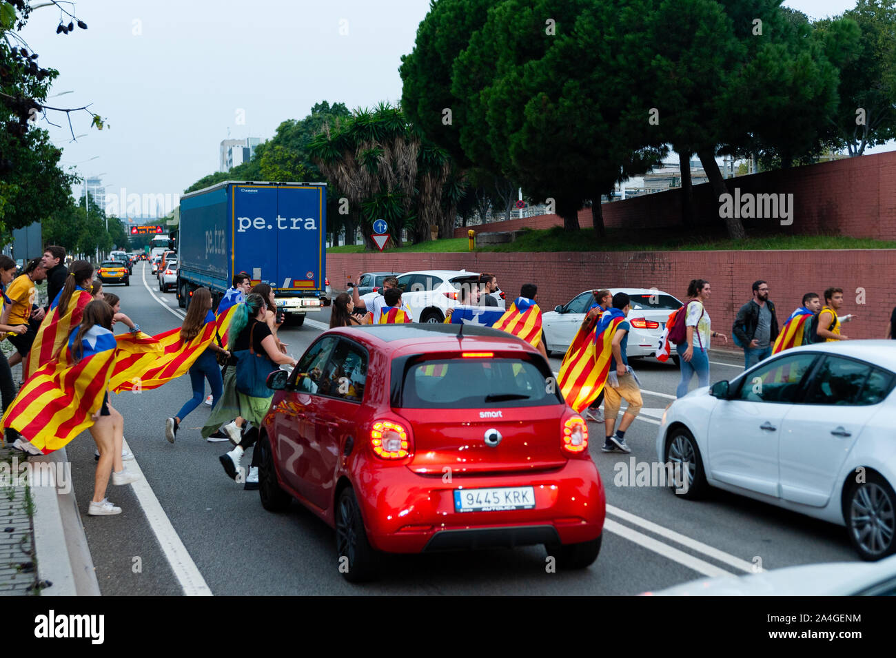 Barcelona, Spain - 14 october 2019: young independentists with catalan flags  block ronda litoral highway in protest against the prison sentence of ca Stock Photo