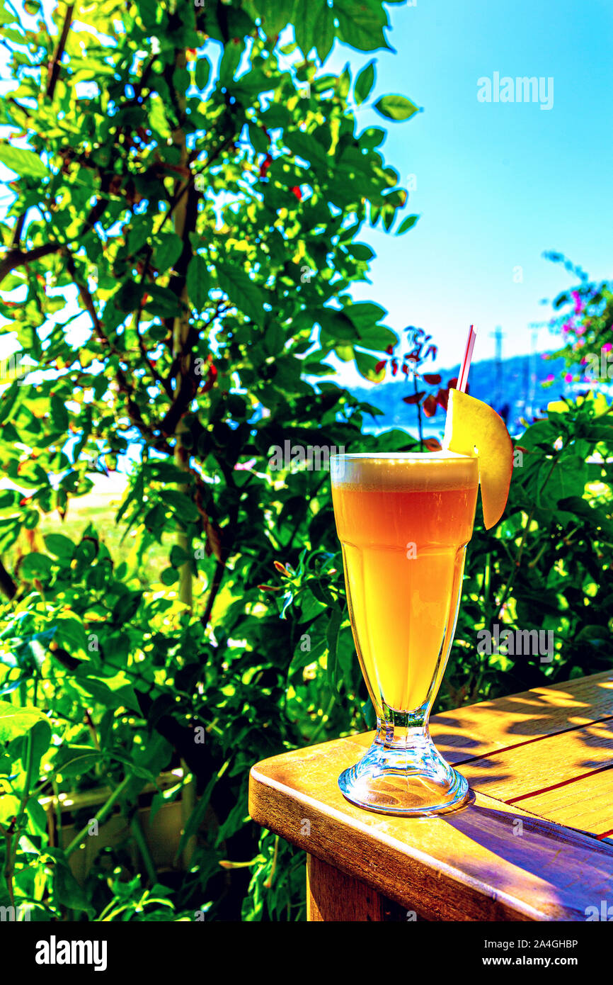 A glass of healthy tropical juice smoothie cocktail at a restaurant in Oludeniz, Turkish Riviera, Turkey Stock Photo