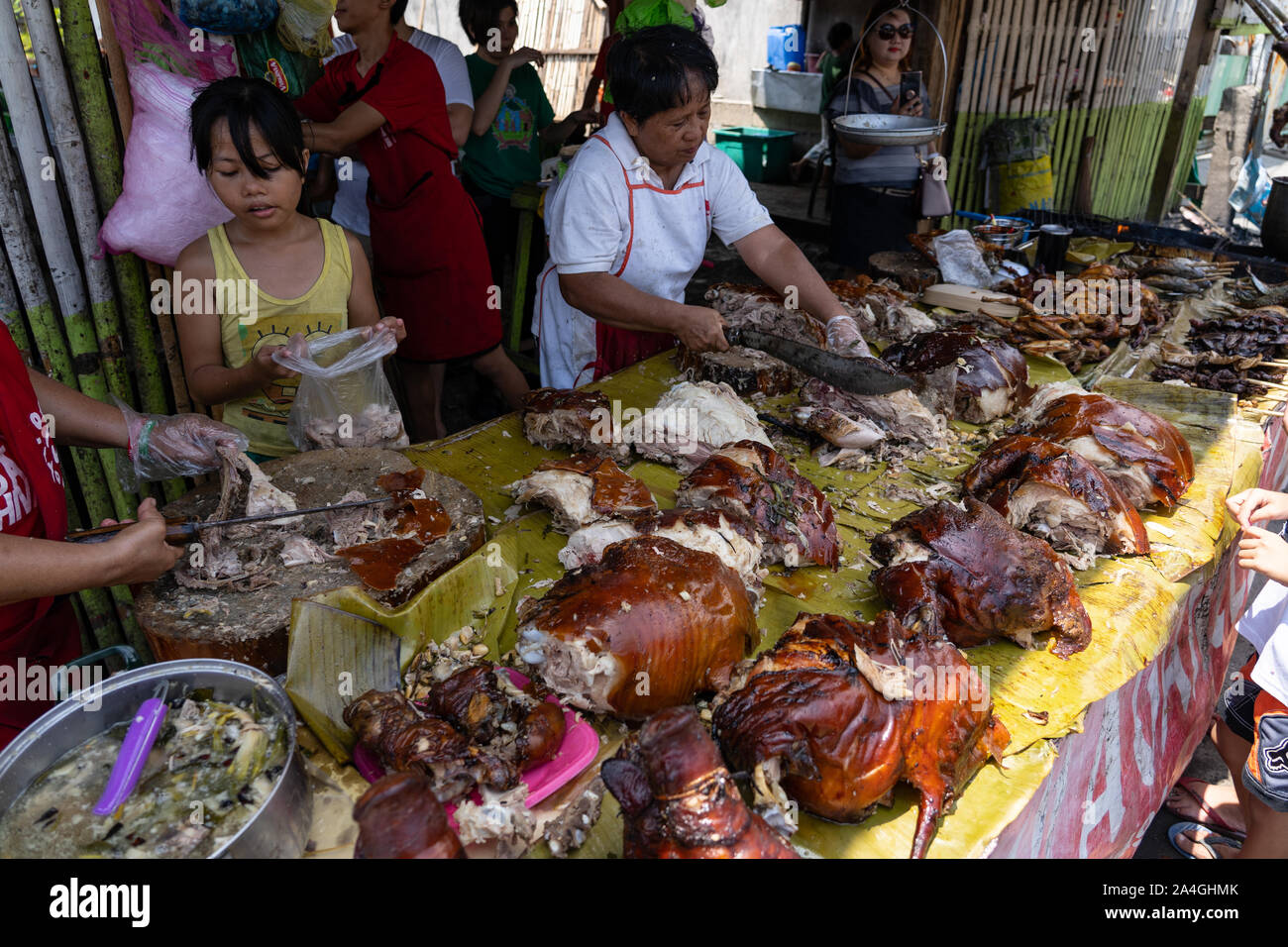 Roasted pig for sale at a street stall in talisay City,Cebu.Known as Lechon,a delicacy within
