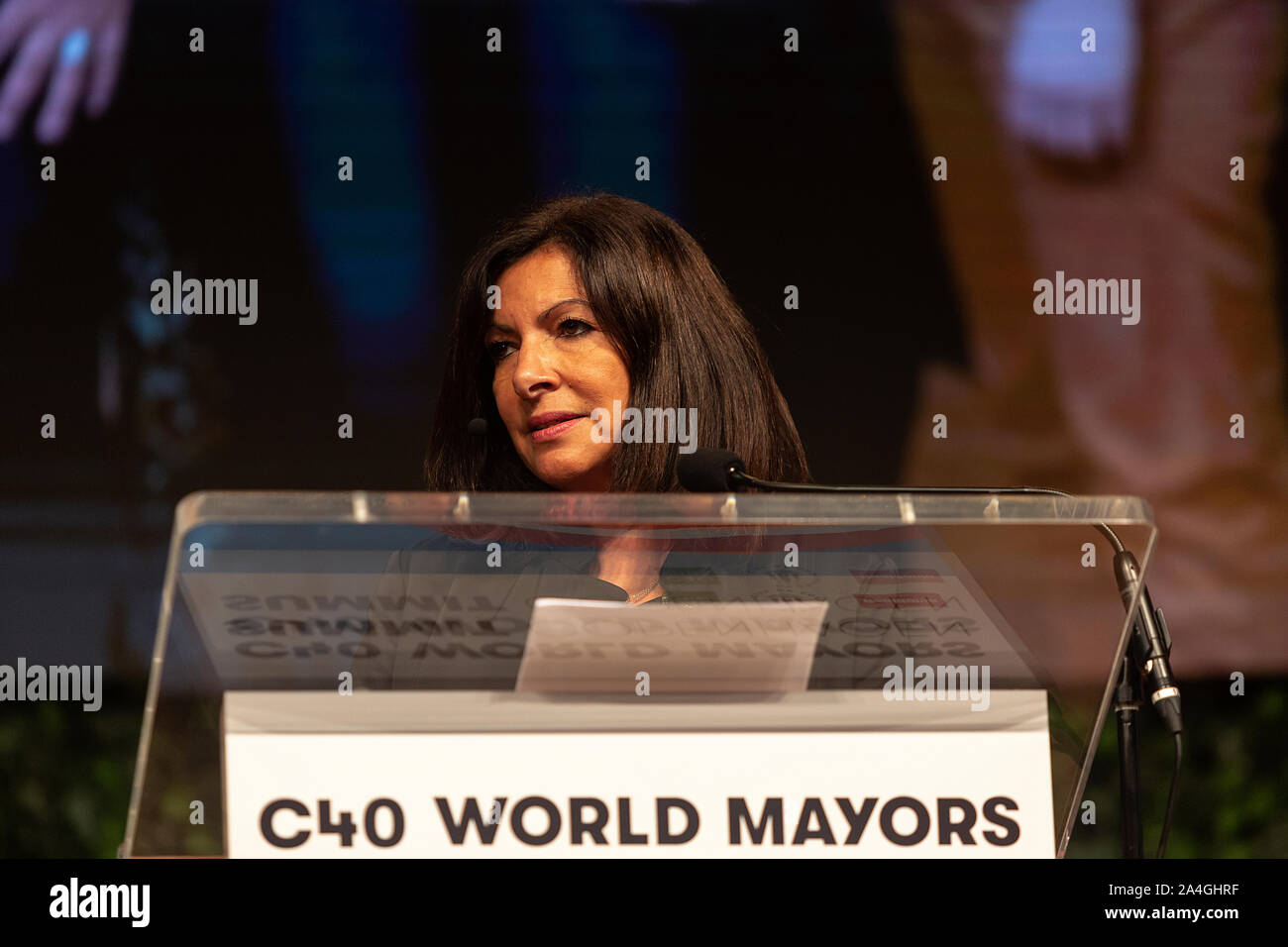 COPENHAGEN, DENMARK -  OCTOBER 10, 2019: Anne Hidalgo, Mayor of Paris and Chair of the C40, during her hand-over speech of the Chair to Eric Garcetti, Mayor of Los Angeles, at the C40 World Mayors Summit 2019 in Copenhagen. More than 70 mayors of some of the world’s largest and most influential cities representing some 700 million people meet in Copenhagen from October 9-12 for the C40 World Mayors Summit. The purpose with the summit in Copenhagen is to build a global coalition of leading cities, businesses and citizens that rallies around radical and ambitious climate action. Also youth leade Stock Photo