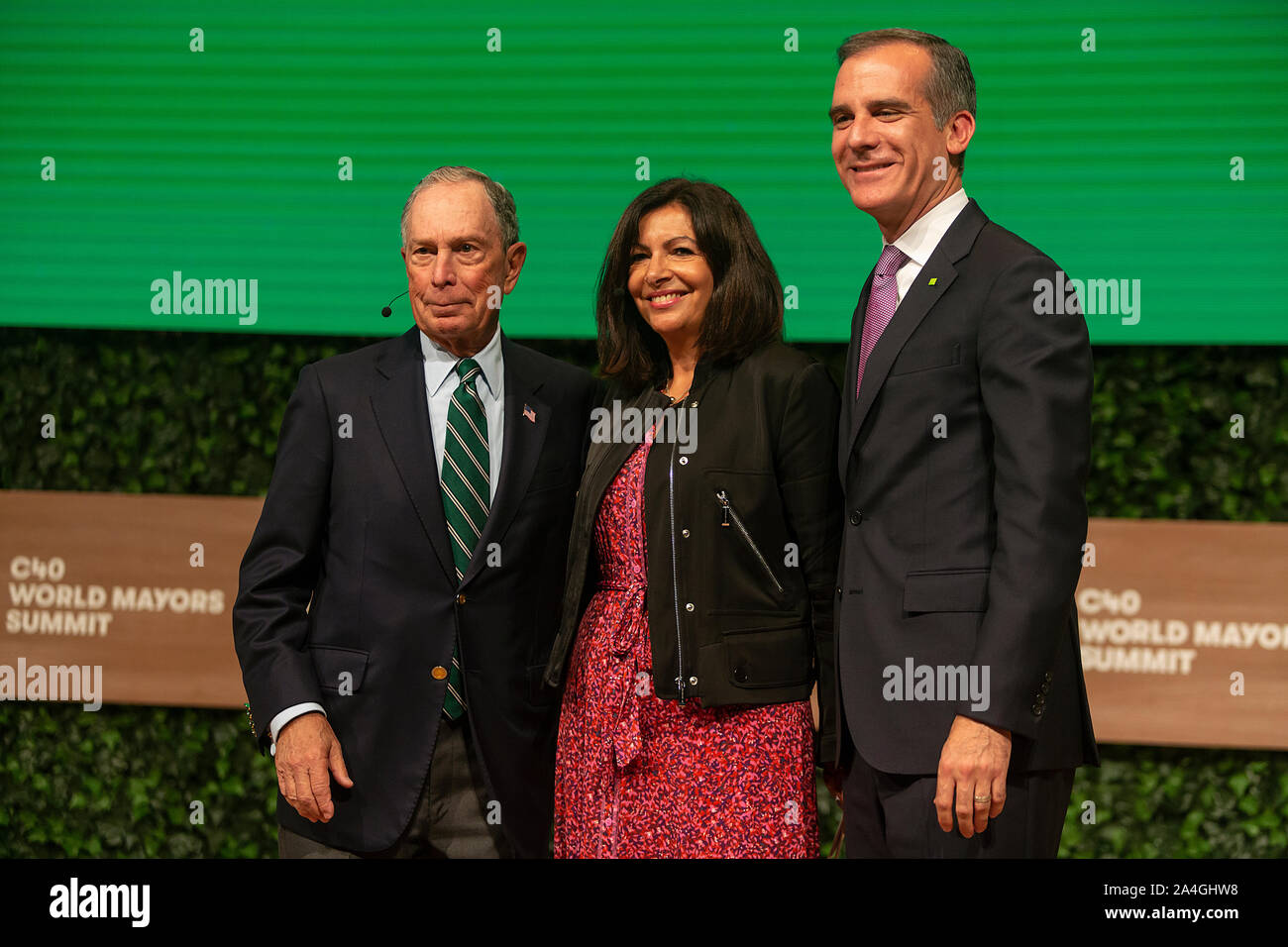 COPENHAGEN, DENMARK -  OCTOBER 10, 2019: Michael Bloomberg (L), Anne Hidalgo, Mayor of Paris and Eric Garcetti (R), Mayor of Los Angeles, at the C40 World Mayors Summit 2019  hand-over of the Chair in Copenhagen. More than 70 mayors of some of the world’s largest and most influential cities representing some 700 million people meet in Copenhagen from October 9-12 for the C40 World Mayors Summit. The purpose with the summit in Copenhagen is to build a global coalition of leading cities, businesses and citizens that rallies around radical and ambitious climate action. Also youth leaders from the Stock Photo