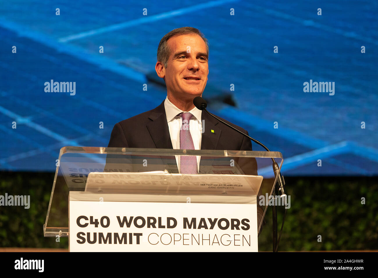 COPENHAGEN, DENMARK -  OCTOBER 10, 2019: Mayor of Los Angeles, Eric Garcetti, during his acceptance speech after hand over of the new chair from Anne Hidalgo, Mayor of Paris, at the C40 World Mayors Summit in Copenhagen. More than 70 mayors of some of the world’s largest and most influential cities representing some 700 million people meet in Copenhagen from October 9-12 for the C40 World Mayors Summit. The purpose with the summit in Copenhagen is to build a global coalition of leading cities, businesses and citizens that rallies around radical and ambitious climate action. Also youth leaders Stock Photo