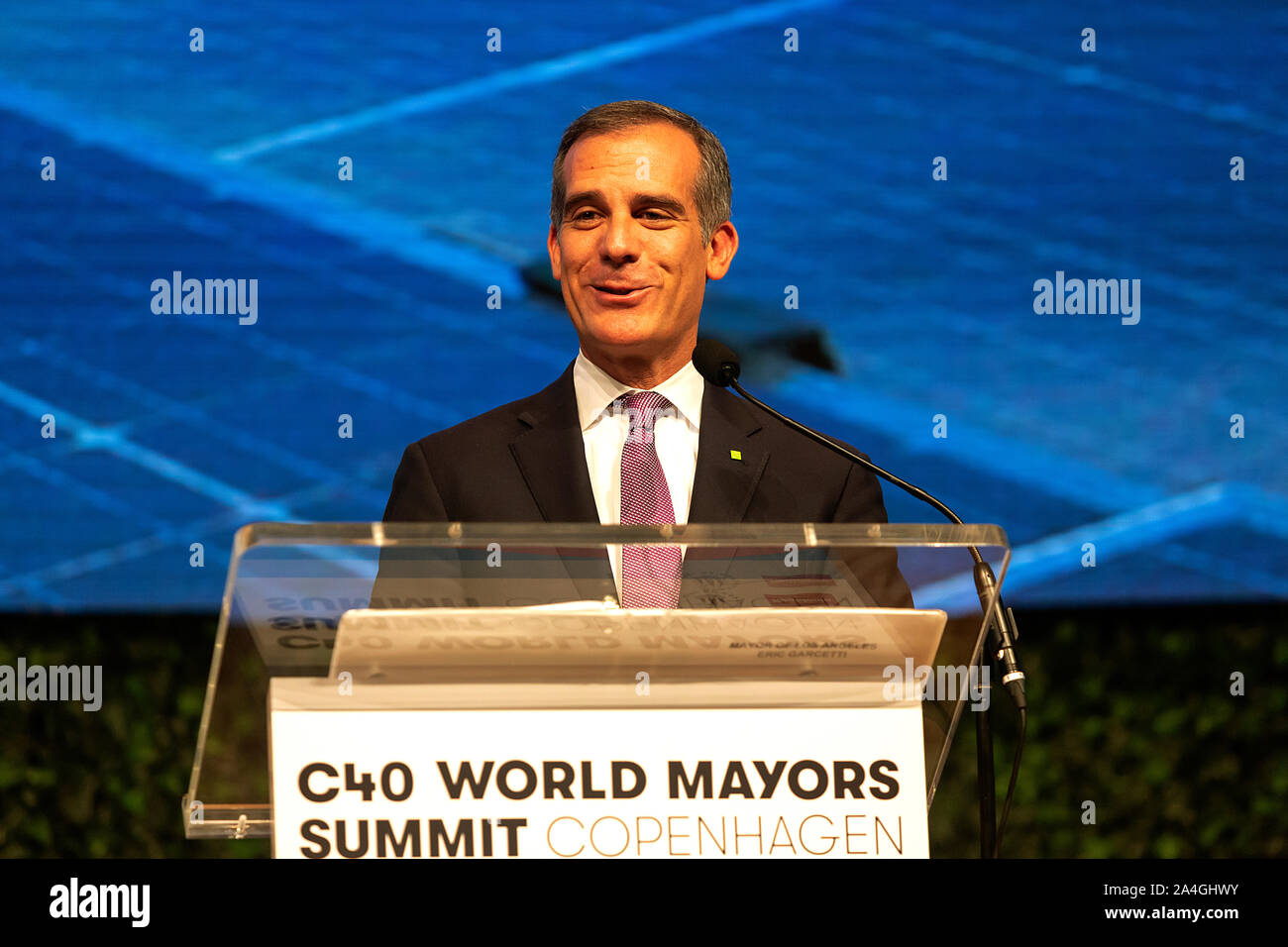 COPENHAGEN, DENMARK -  OCTOBER 10, 2019: Mayor of Los Angeles, Eric Garcetti, during his acceptance speech after hand over of the new chair from Anne Hidalgo, Mayor of Paris, at the C40 World Mayors Summit in Copenhagen. More than 70 mayors of some of the world’s largest and most influential cities representing some 700 million people meet in Copenhagen from October 9-12 for the C40 World Mayors Summit. The purpose with the summit in Copenhagen is to build a global coalition of leading cities, businesses and citizens that rallies around radical and ambitious climate action. Also youth leaders Stock Photo