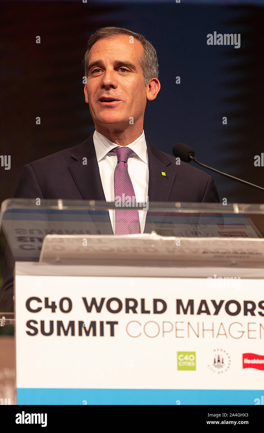 COPENHAGEN, DENMARK -  OCTOBER 10, 2019: Mayor of Los Angeles, Eric Garcetti, during his acceptance speech after hand over of the new chair from Anne Hidalgo, Mayor of Paris, at the C40 World Mayors Summit in Copenhagen. More than 70 mayors of some of the world’s largest and most influential cities representing some 700 million people meet in Copenhagen from October 9-12 for the C40 World Mayors Summit. The purpose with the summit in Copenhagen is to build a global coalition of leading cities, businesses and citizens that rallies around radical and ambitious climate action. Also youth leaders Stock Photo