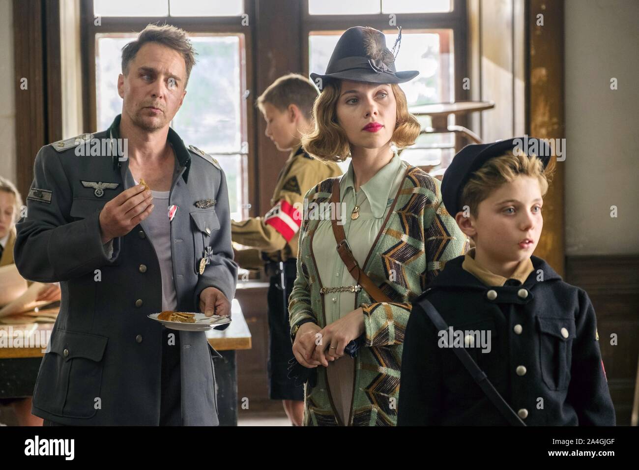 JOJO RABBIT, from left: Sam Rockwell, Scarlett Johansson, Roman Griffin ...