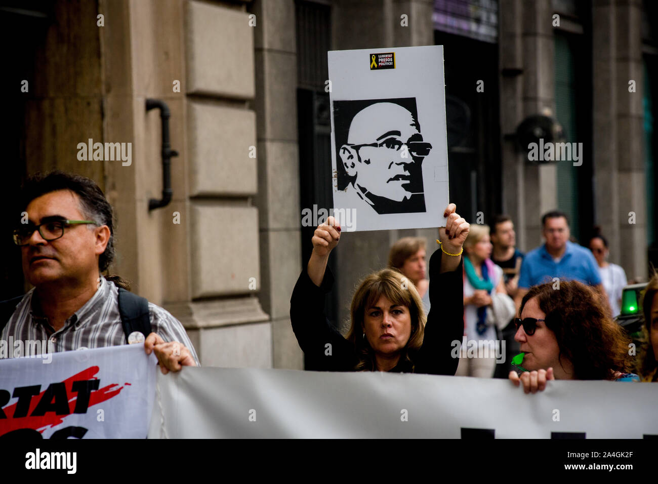 In Barcelona people go out into the streets to block the traffic as hold banners with the faces of the imprisoned political leaders after the sentence of the Spanish supreme court has been made public. Catalan separatist leaders have been found guilty of the  crimes of sedition and misuse of public funds and face prison terms ranging from nine to 13 years. Stock Photo