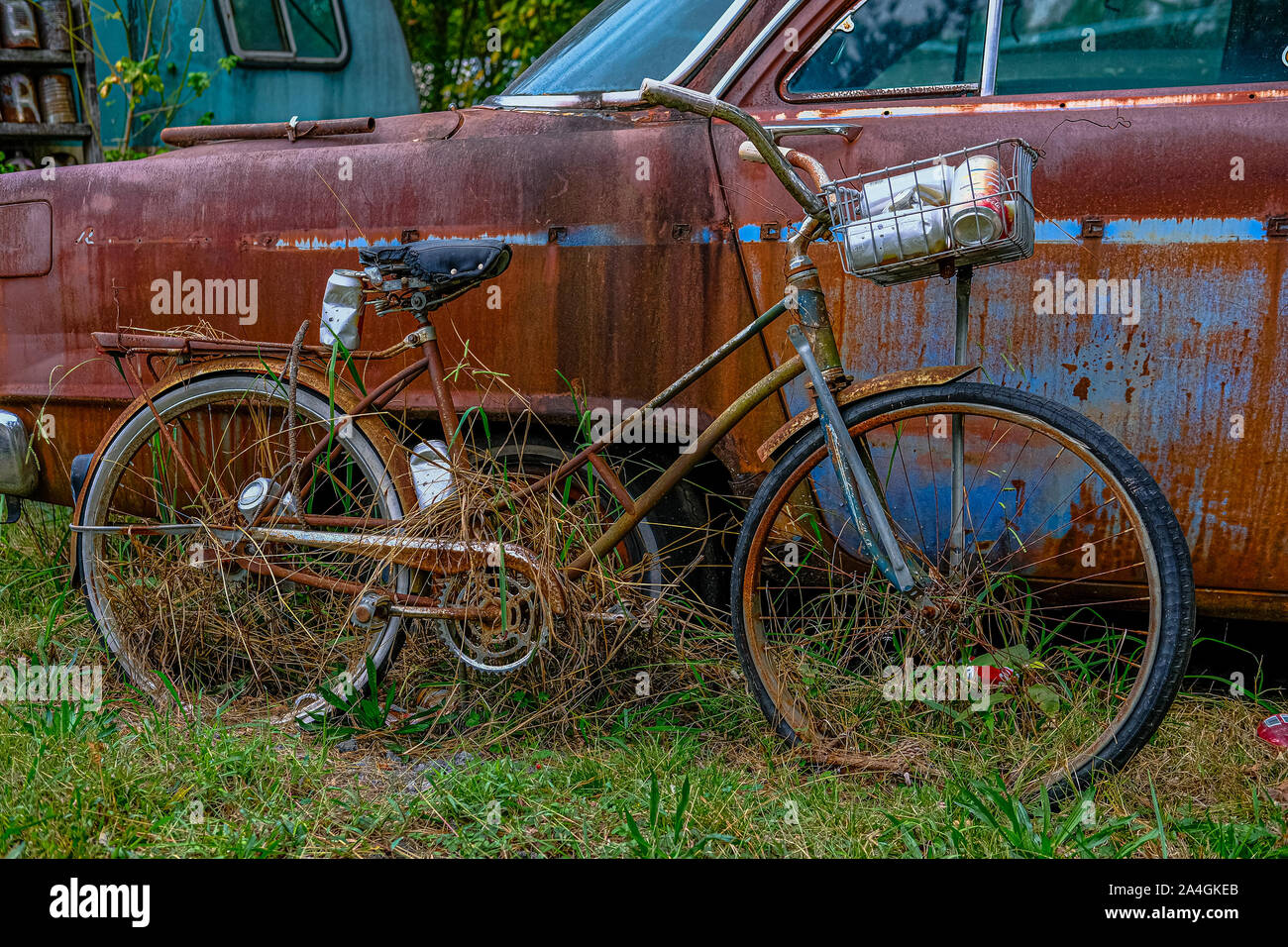 Rusty Bike by Old Car Stock Photo