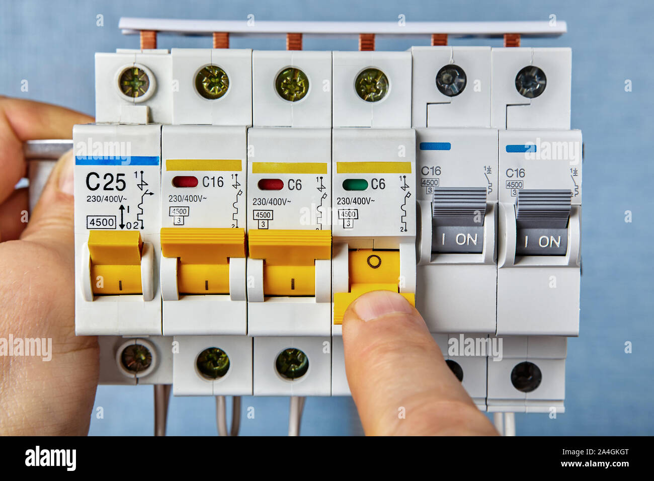 Fuse board replacement. Circuit breakers are the most common form of overload protection found in homes. Electrical consumer unit installation. Stock Photo