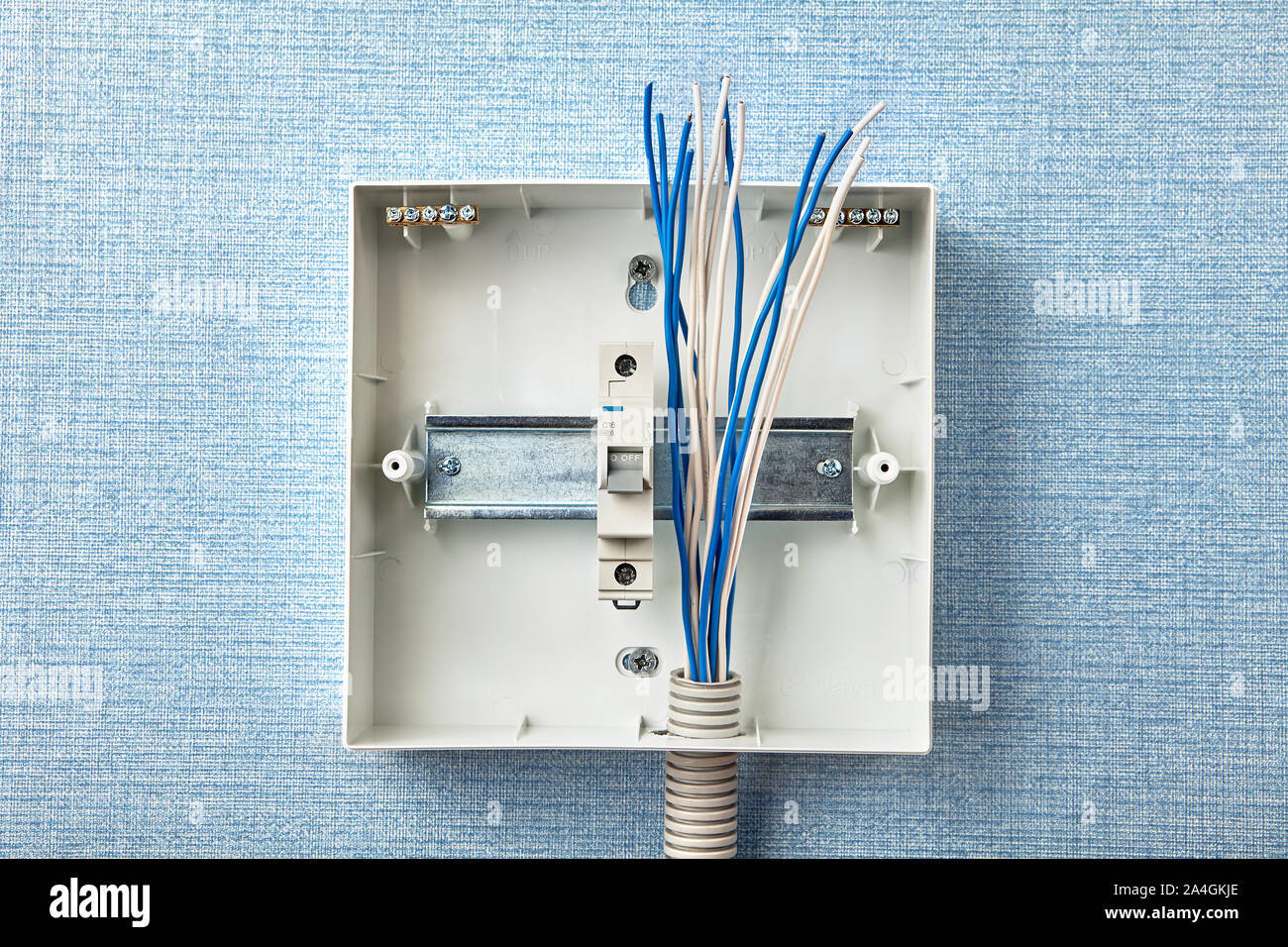 Electrical services to fuse board upgrades. Electricity supply and consumer unit in a house. Metal mounting straight edge guide DIN rail. Home circuit Stock Photo