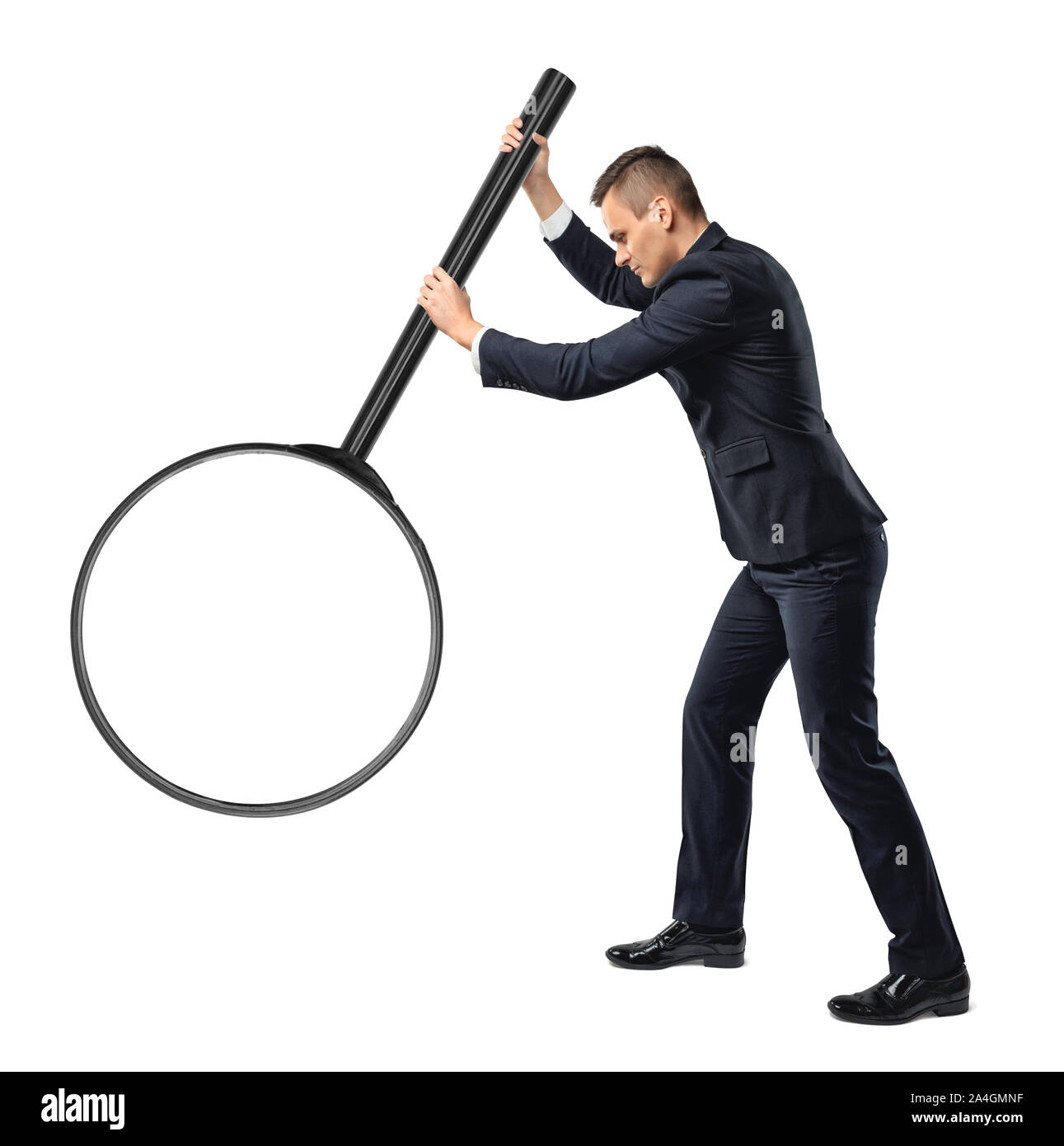 Back view of a businessman holding big magnifying glass in his