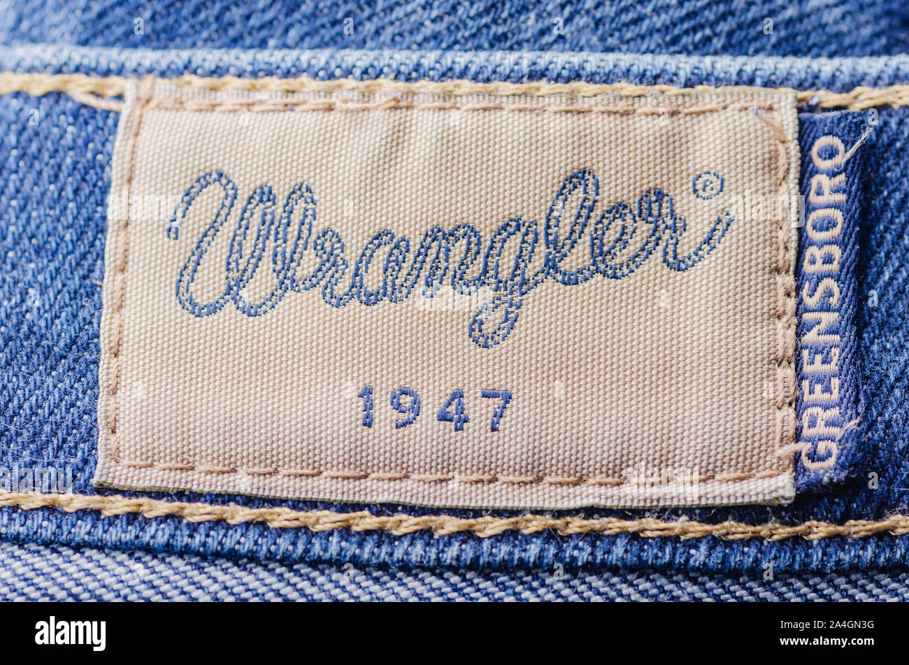 Closeup of Wrangler label on blue jeans Stock Photo - Alamy