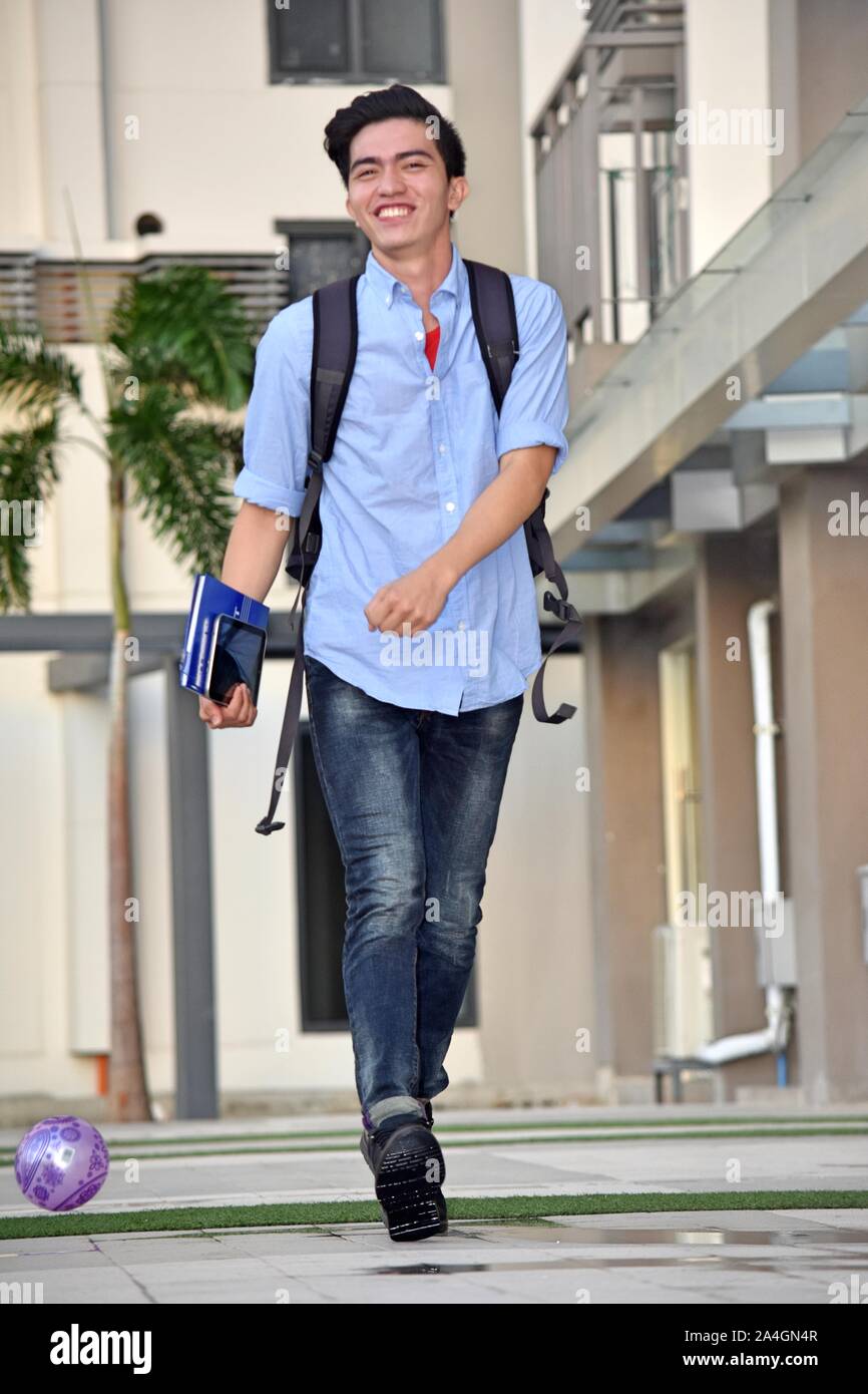 Handsome Asian Male Student Having Fun With Notebooks Walking Stock ...