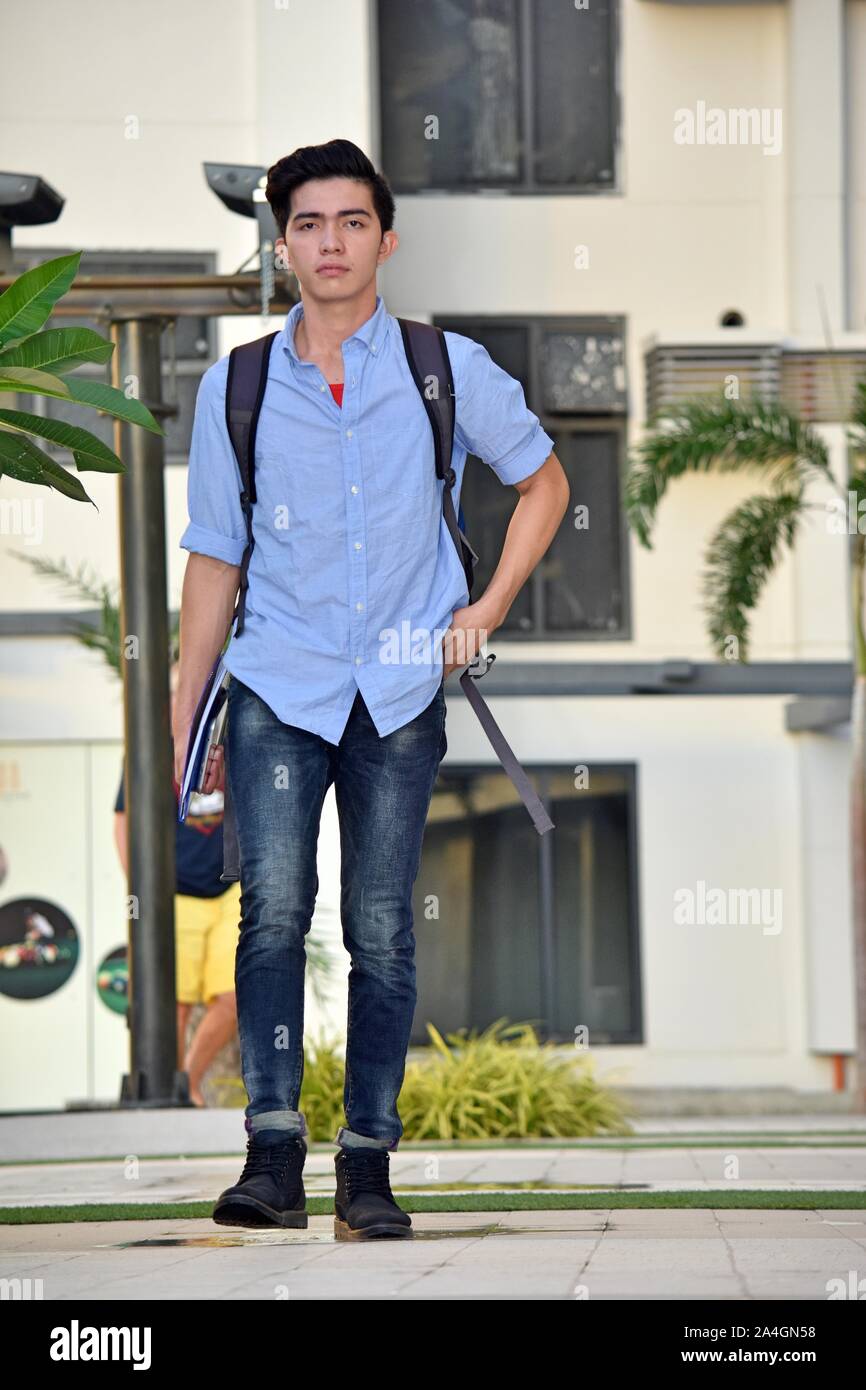 Serious College Minority Boy Student Walking On Campus Stock Photo - Alamy