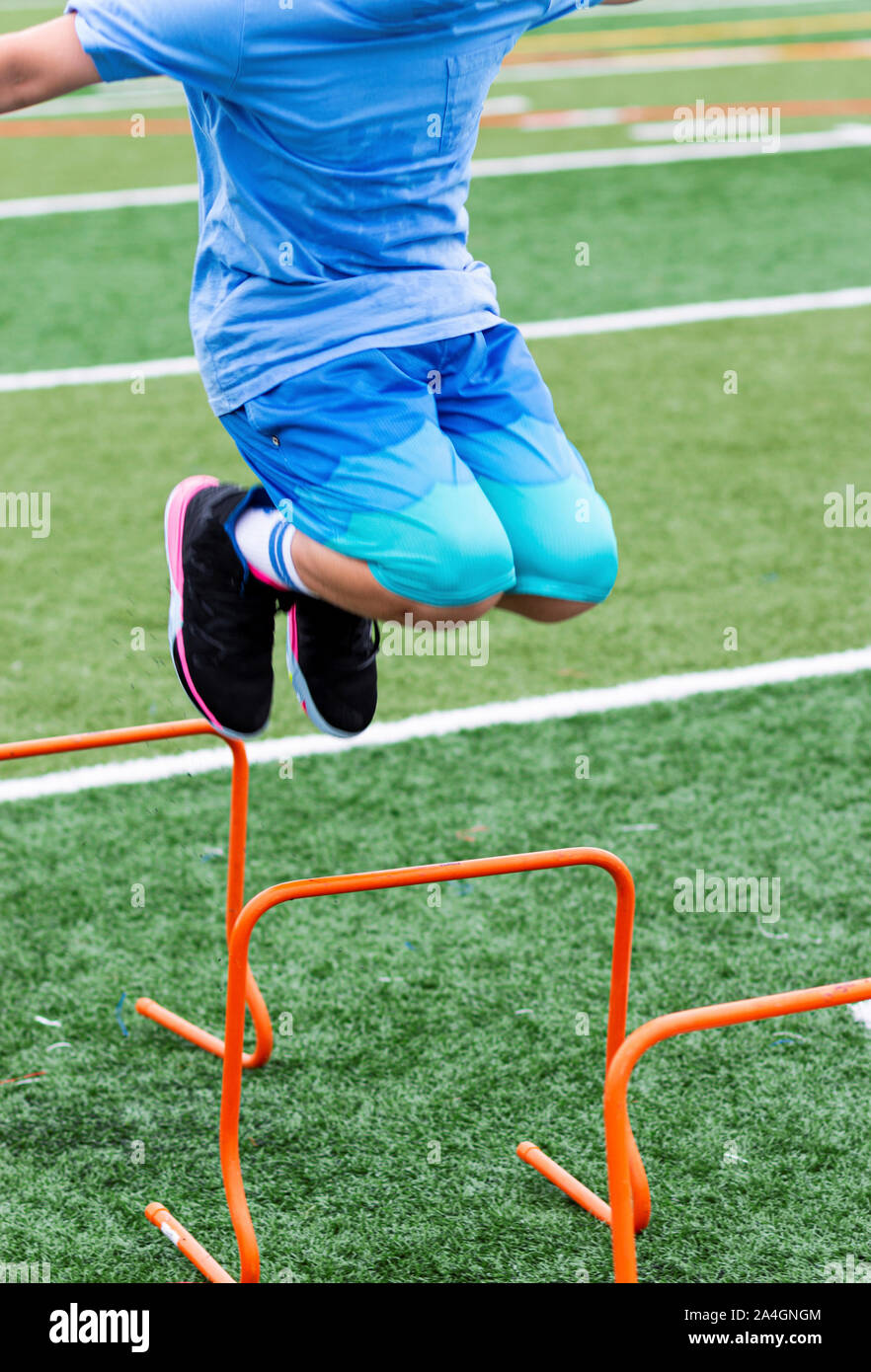 Athlete jumping over hurdle hires stock photography and images Alamy