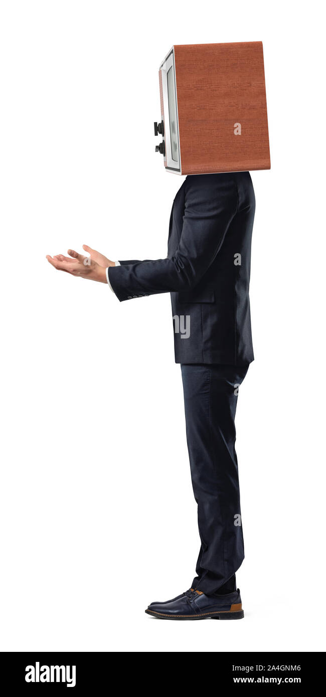 An isolated businessman stands in a side view with empty outstretched arms and a TV set replacing his head. Stock Photo
