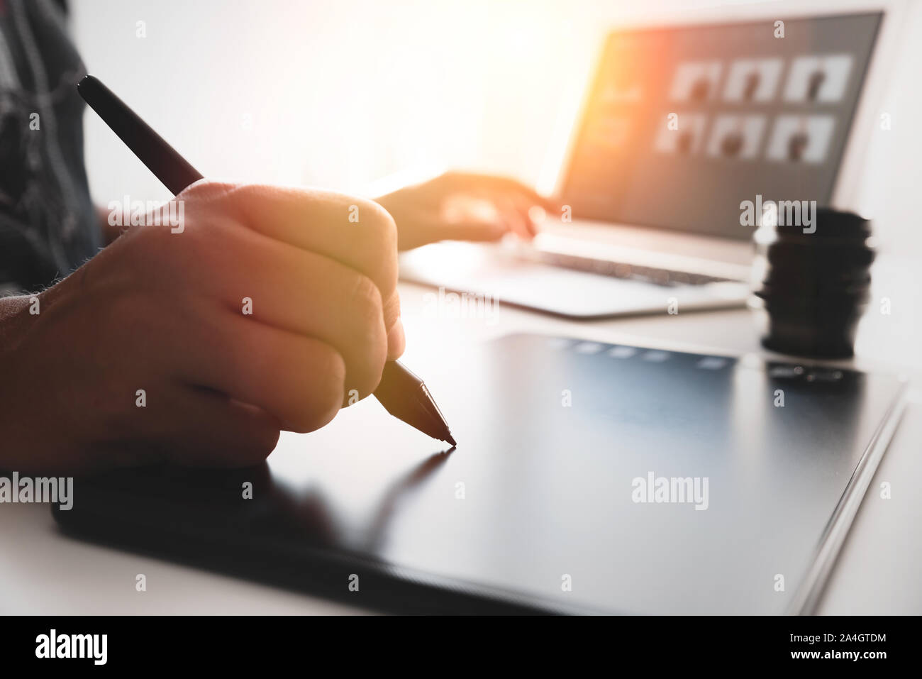 Man using graphic tablet and pan. Graphic designer at work in office Stock Photo