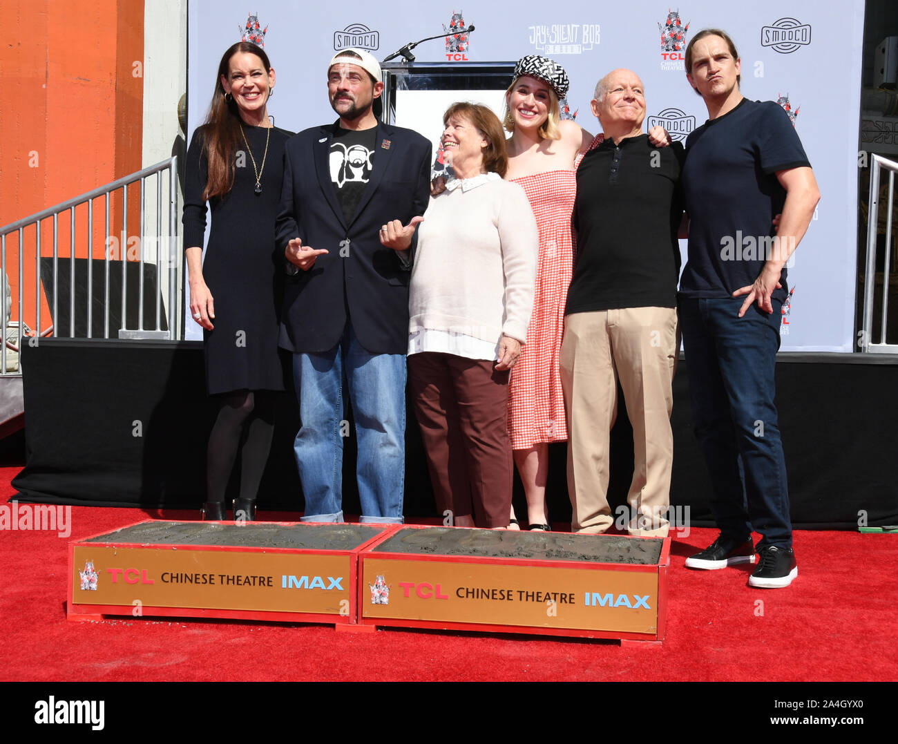 Los Angeles, USA. 13th Oct, 2019. Jennifer Schwalbach Smith, Kevin Smith, Harley Quinn Smith. Kevin Smith And Jason Mewes Hands And Footprint Ceremony held at TCL Chinese Theatre. Photo Credit: Birdie Thompson/AdMedia /MediaPunch Credit: MediaPunch Inc/Alamy Live News Stock Photo