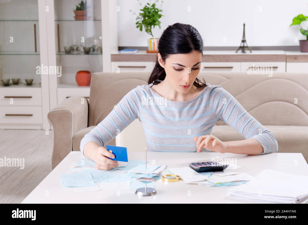 The young woman in budget planning concept Stock Photo