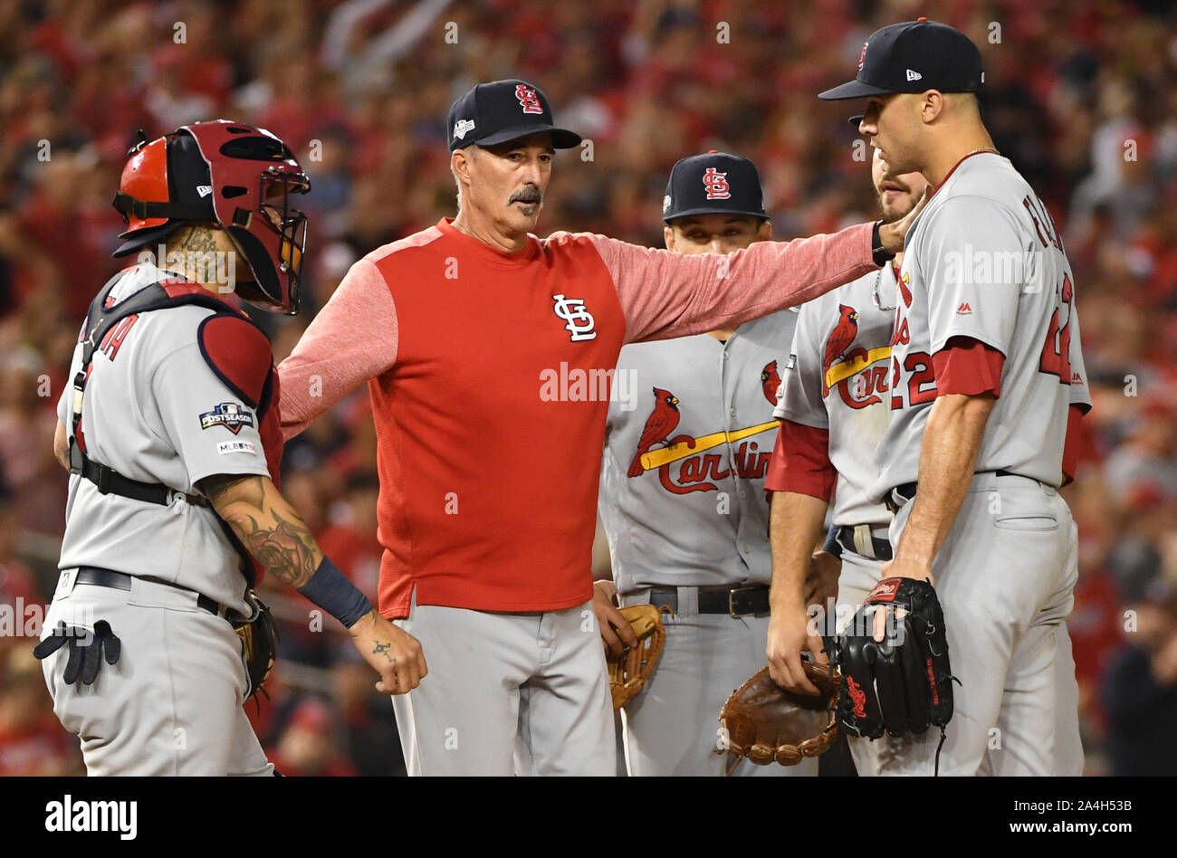 Washington, United States. 14th Oct, 2019. The St. Louis Cardinals hold a conference on the pitching mound with starter Jack Flaherty (R) during the third inning of game 3 in the NLCS at Nationals Park in Washington, DC, on Monday, October 14, 2019. Photo by Kevin Dietsch/UPI Credit: UPI/Alamy Live News Stock Photo