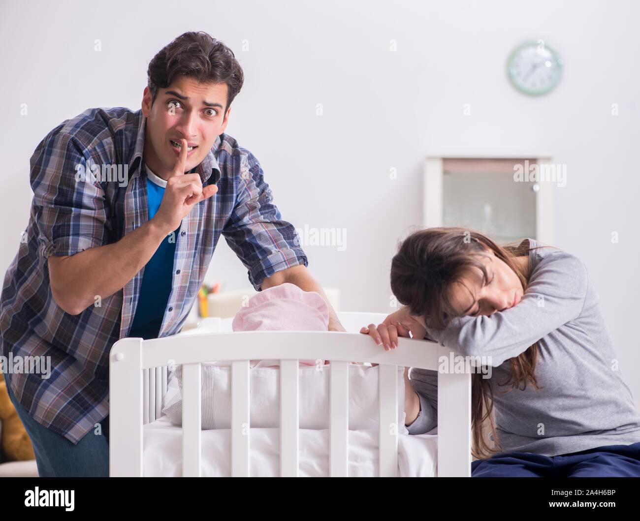 The young dad cannot stand baby crying Stock Photo - Alamy