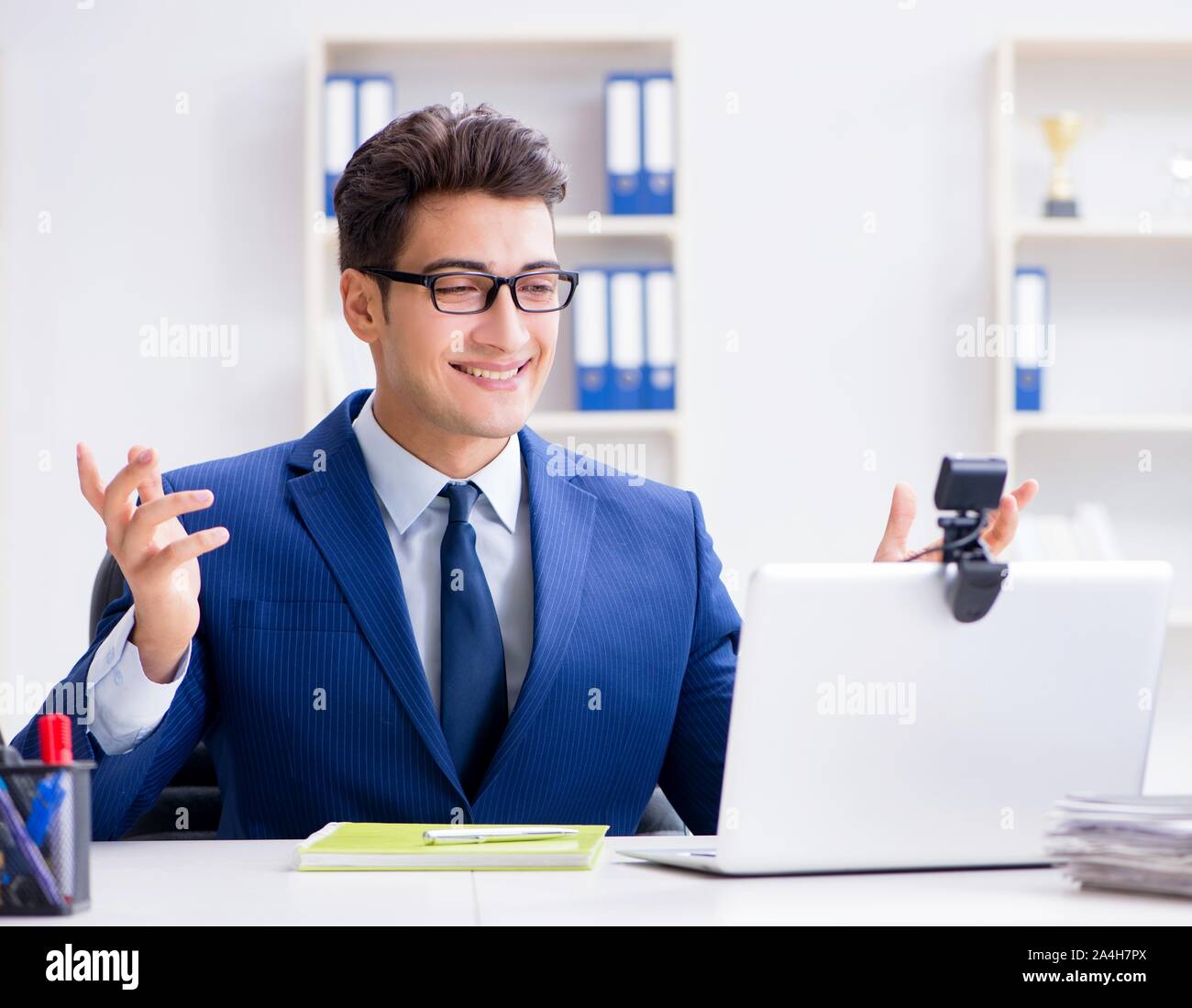 The Young Help Desk Operator Working In Office Stock Photo