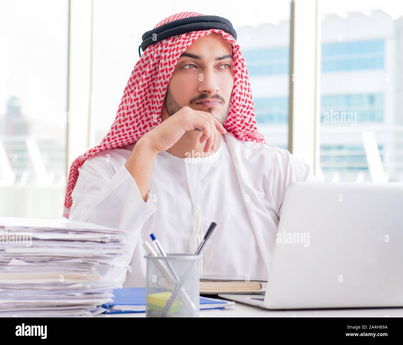 The arab businessman working in the office Stock Photo - Alamy
